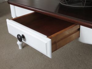 opened drawer with new knob and distressed snow white coffee table